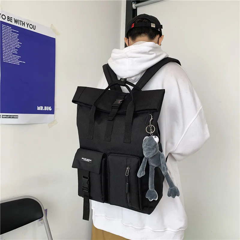 

Japanese fashion backpack female high school students Korean tooling schoolbag male large capacity square travel computer bag.