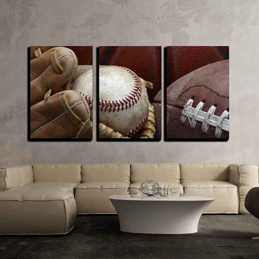

3 Piece Canvas Wall Art Close Up Shot of Well Worn Baseball in Baseball Glove, Football and Basketball Drop shipping
