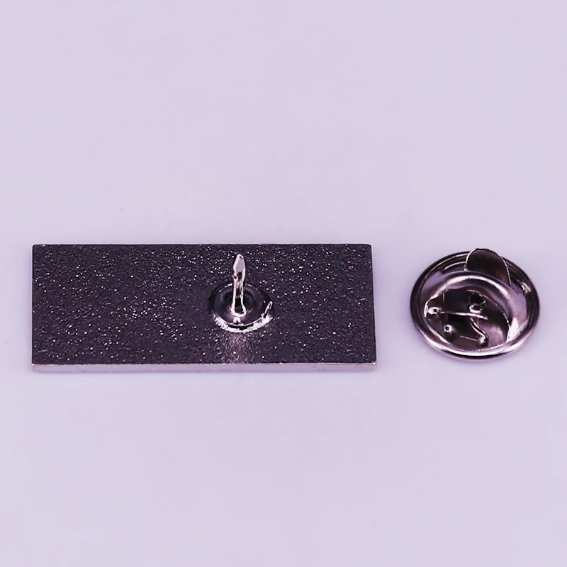 The rectangular brooch features a SPEW design so you can help Hermione raise awareness of this grave issue affecting wizarding society..JPG