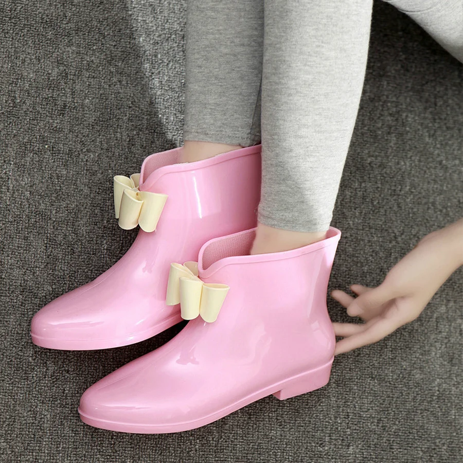 pink rain boots with bow