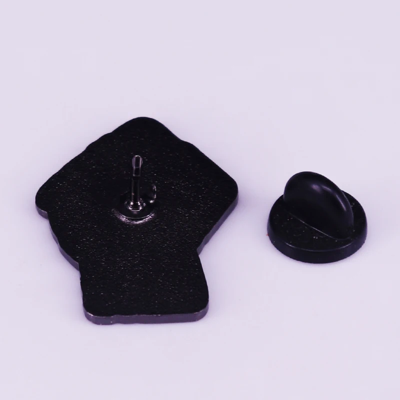 Black power brooch raised fist has become a unifying symbol of resistance against Trump and a call for racial justice