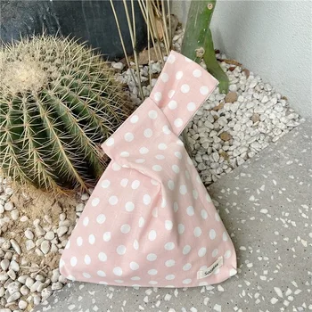 

Japanese-style Korean chic simple polka dot hand bag to pull out literary tack mobile phone coin purse female