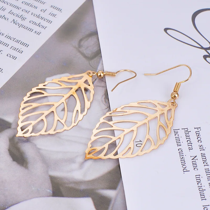HIYONG Pendientes Mujer Горячая Мода оптом полые металлические листья Висячие длинное