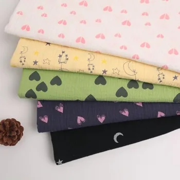 

New high-quality cotton cartoon star moon double gauze fold yarn-dyed printed cloth baby pajamas saliva towel fabric