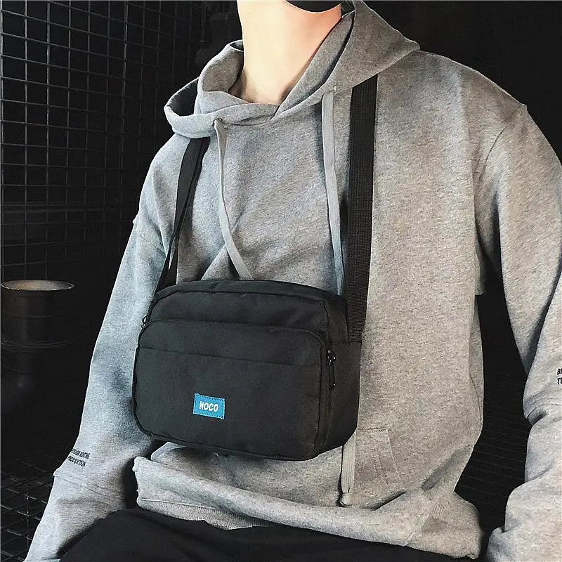 

Brand Originality Design new messenger bag men's canvas men's shoulder bag sports tide brand small satchel female students tide