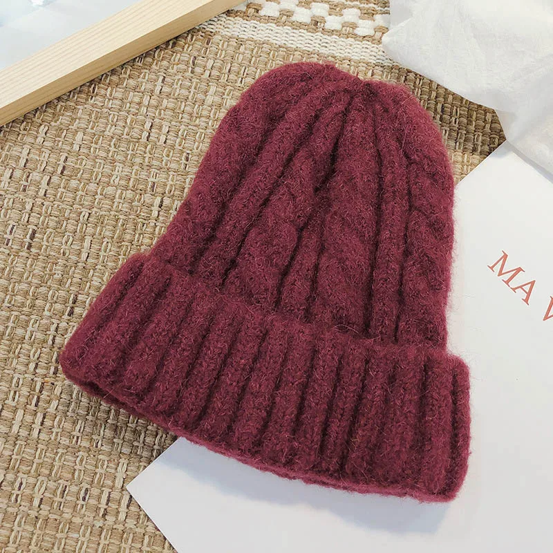 New trend hat wool hat Korean version of the wild outdoor thick warm knitted hat pure color twist hat