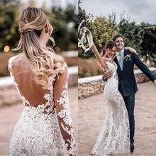 

Sexy 2019 Sheer Lace Mermaid Wedding Dresses Tulle Applique Backless Sweep Train Long Sleeves Arabic Bohemia Wedding