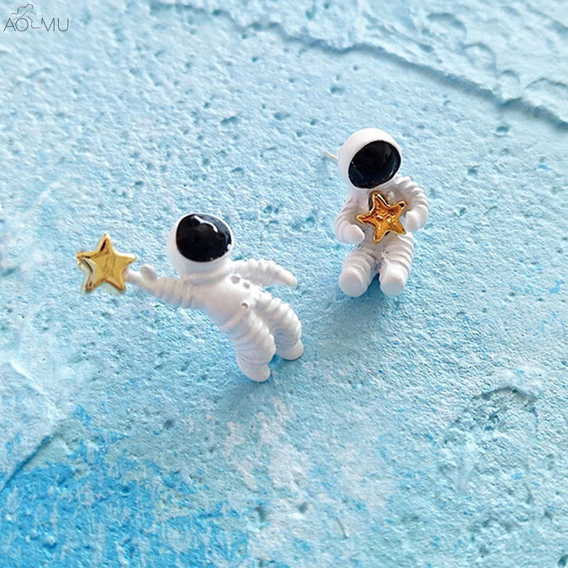 

AOMU 2019 Korean Sweet Cute Starry Sky Space Star Asymmetrical Astronaut Mini Stud Earrings for Women Girl Gift Party Jewelry