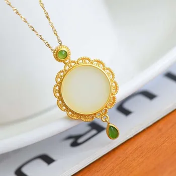 

New antique silver hollow inlaid and field white jade tassel pendant