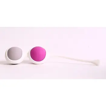 

Vaginal balls of different weight in white holder