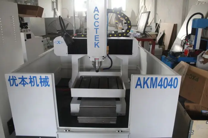 Jinan AccTek factory directly supply semi-closed heavy duty structure mini cnc router engraving/cutting machine AKM4040H