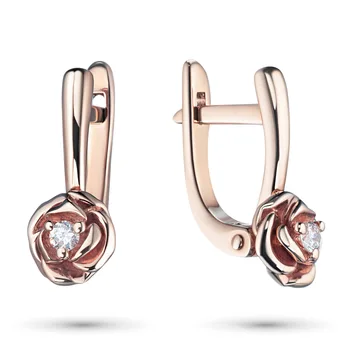 

Earrings in red gold with a diamond