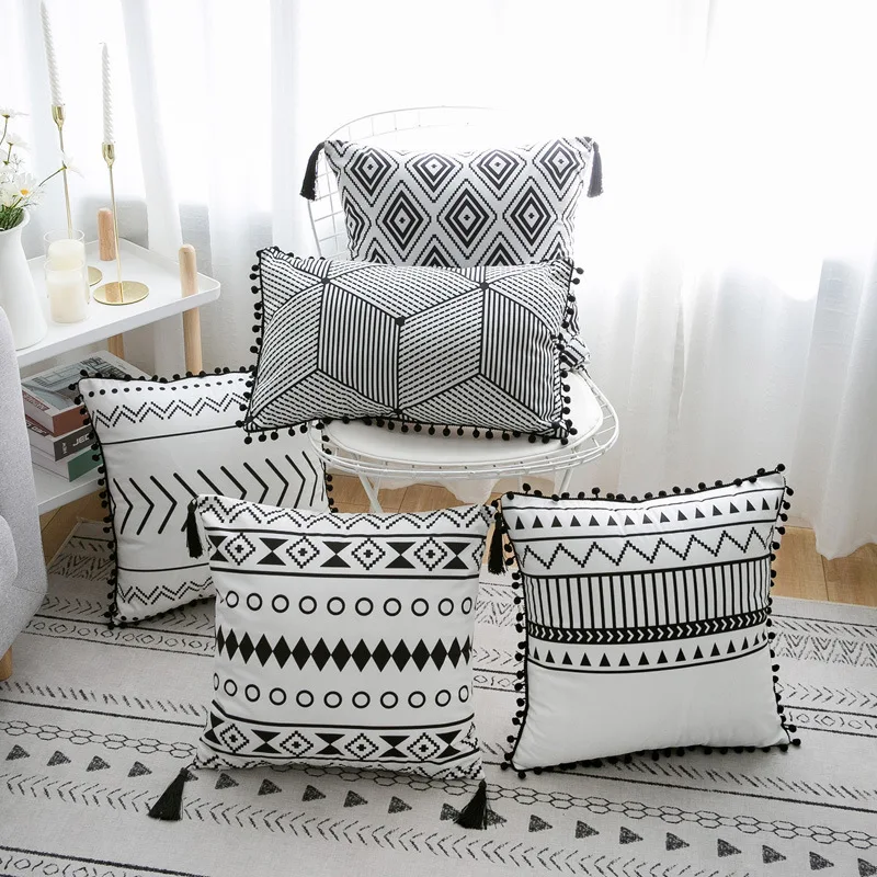 Decorative cushion boho with fringes and pompoms