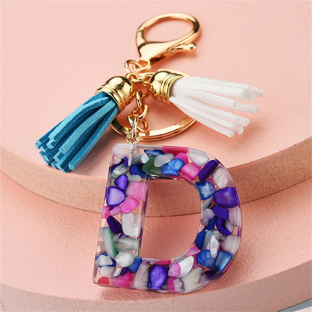 Women Keychains 26 Glitter Hollowed-out Words Handbag Tassel English Letter Keyring with Puffer Ball Charms Free Shipping