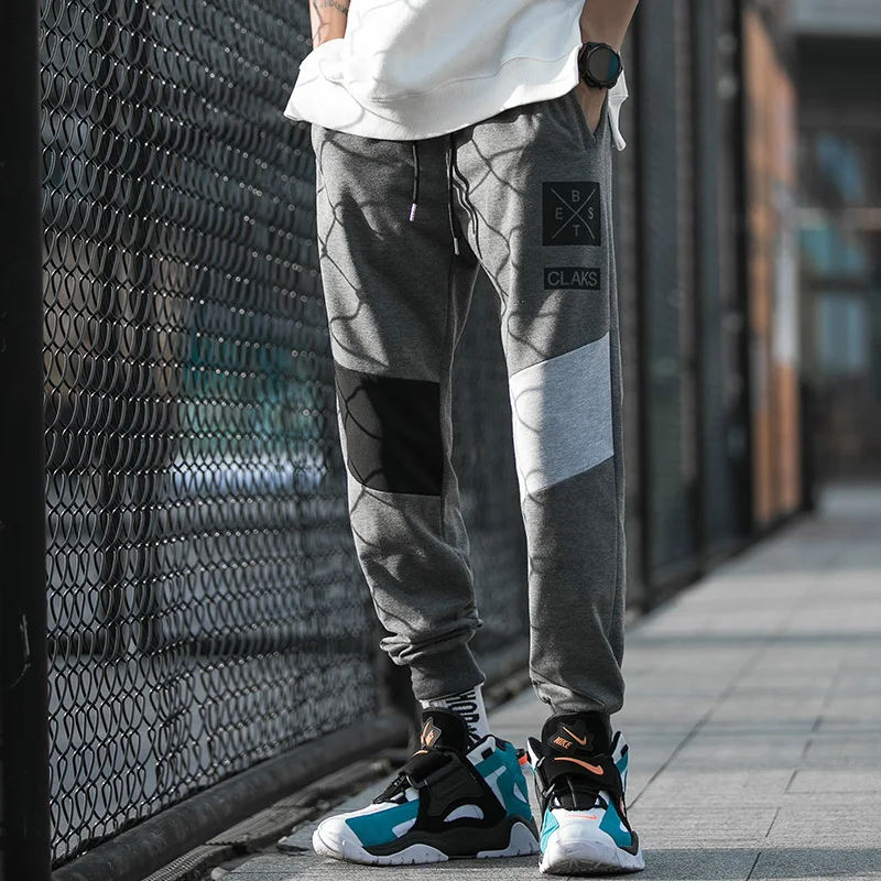 

UYUK2019 autumn and winter new loose casual pants printing stitching contrast color beam foot nine points men's sweatpants