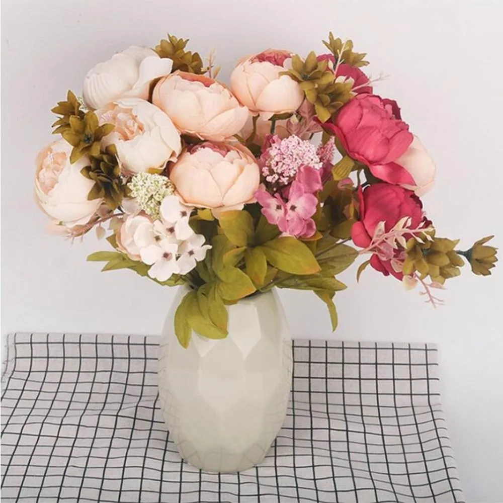 Dining room table decorated false flowers core peony peony flower shape