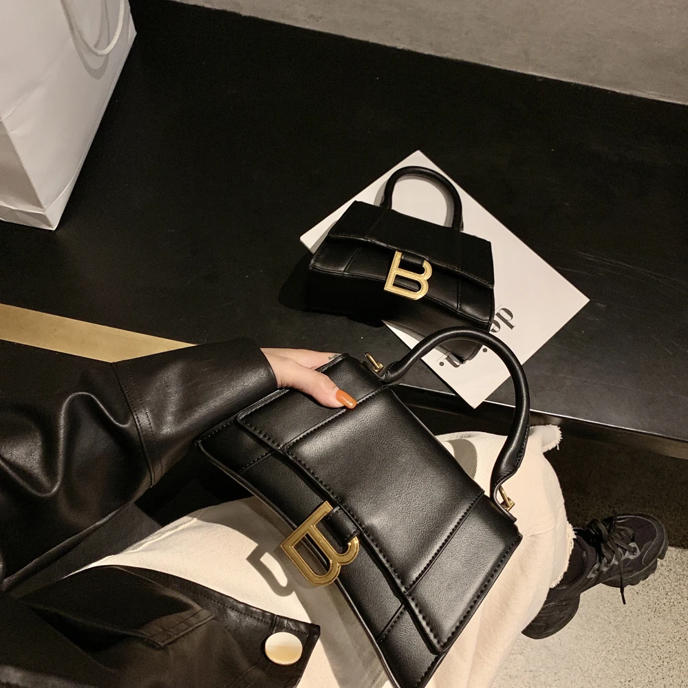 

Leather B-shaped gold buckle hourglass bag saddle bag female 20120 new shoulder Messenger bag