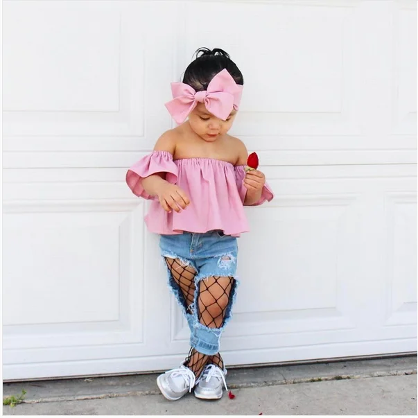 ripped jeans with fishnet tights