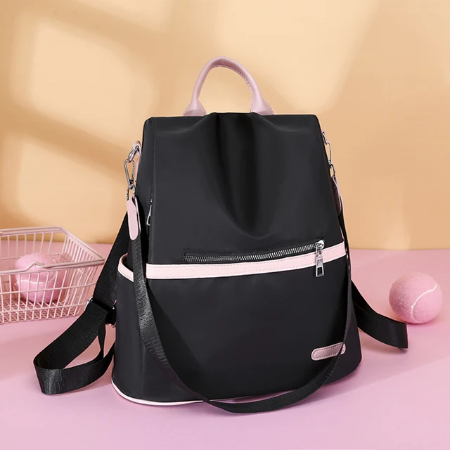 Comprar Mochila antirrobo para mujer, bolso escolar a la moda, sencillo, de  color liso, de tela Oxford, bandolera