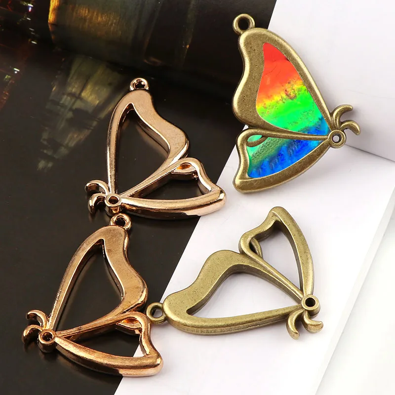 1pc-Vintage-Mix-Color-Butterfly-Antique-Metal-Hollow-Frame-Glue-Blank-Connector-Charms-Pendant-DIY-Jewelry (1)