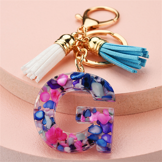 Women Keychains 26 Glitter Hollowed-out Words Handbag Tassel English Letter Keyring with Puffer Ball Charms Free Shipping
