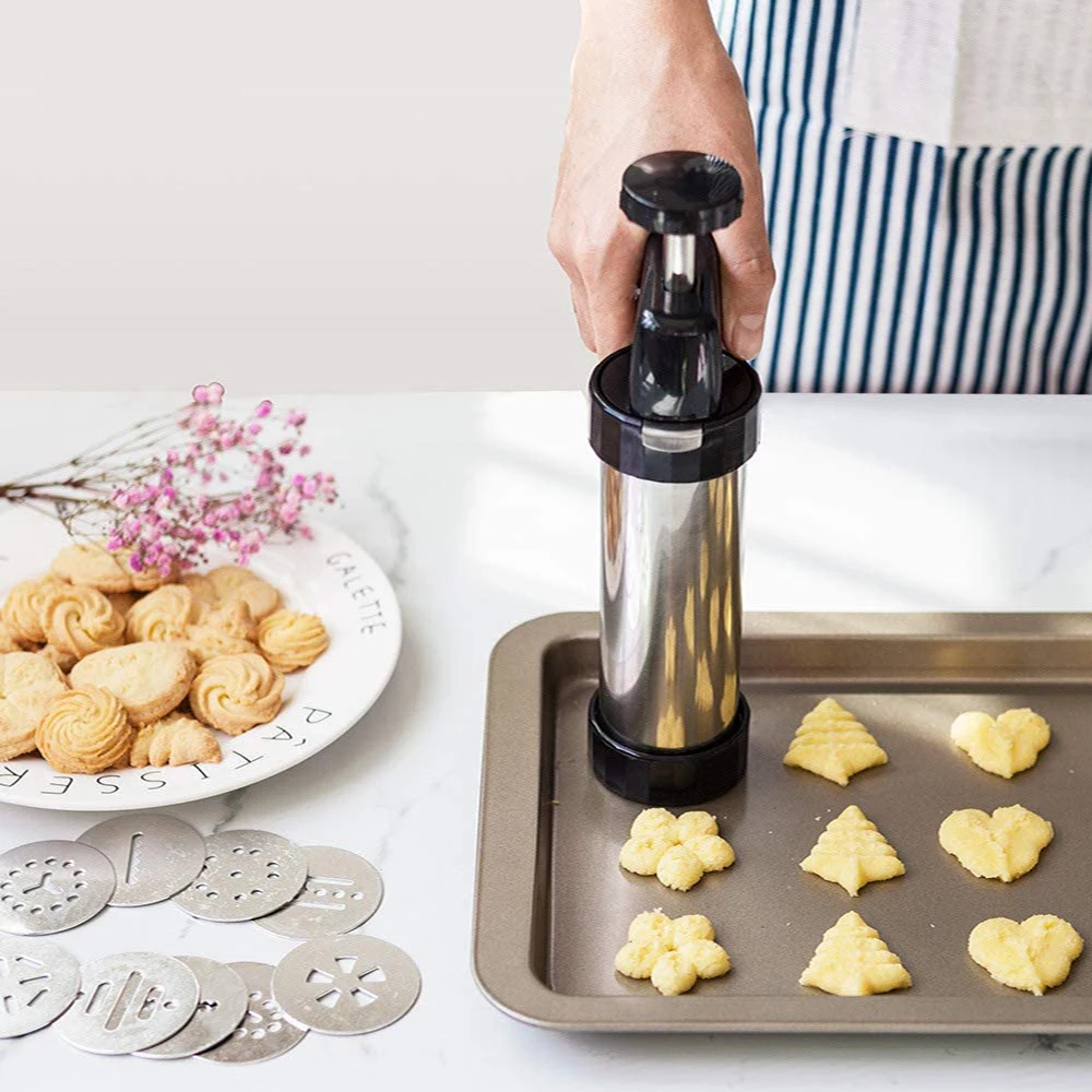 https://ae01.alicdn.com/kf/H4f77df5fe4c34a4ba0d62a5fb6e727acI/DIY-Manual-Cookie-Press-Maker-Machine-Gun-Stainless-Steel-Piping-Nozzles-Biscuit-Make-Cake-Decoration-Tools.jpg