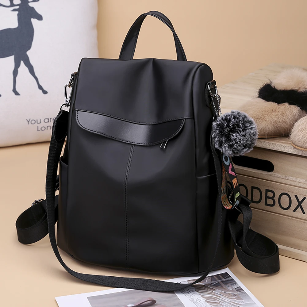 Mochila sencilla de viaje para mujer, bolso escolar Oxford de gran capacidad, informal, con Bola de Pelo, para adolescentes