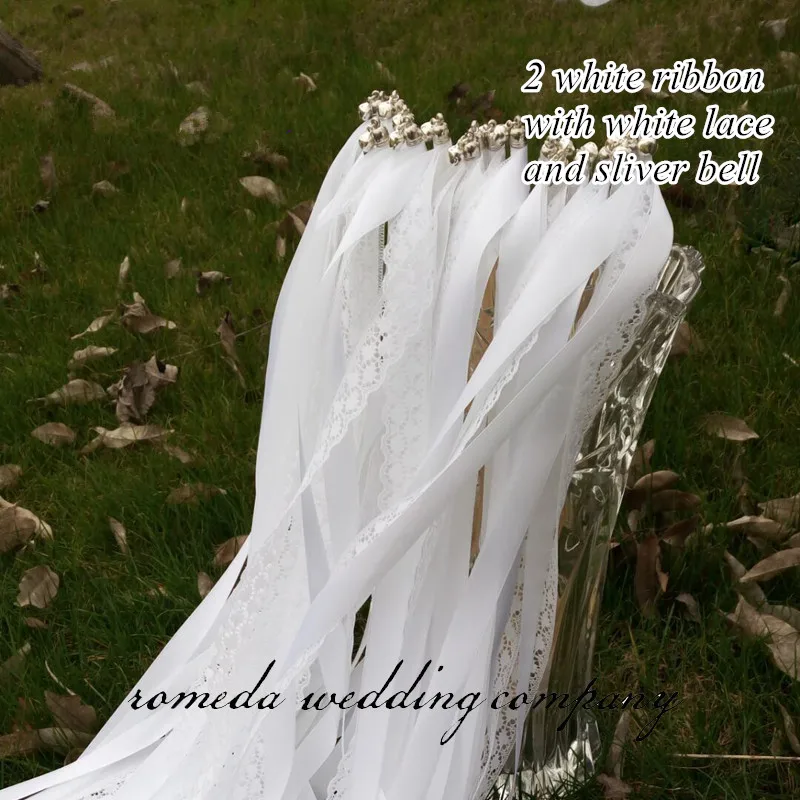 white ribbon sliver bell