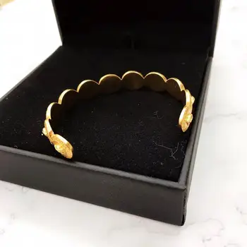 

New style golden bracelet Open bracelet Beautiful girl head bracelet Highest quality