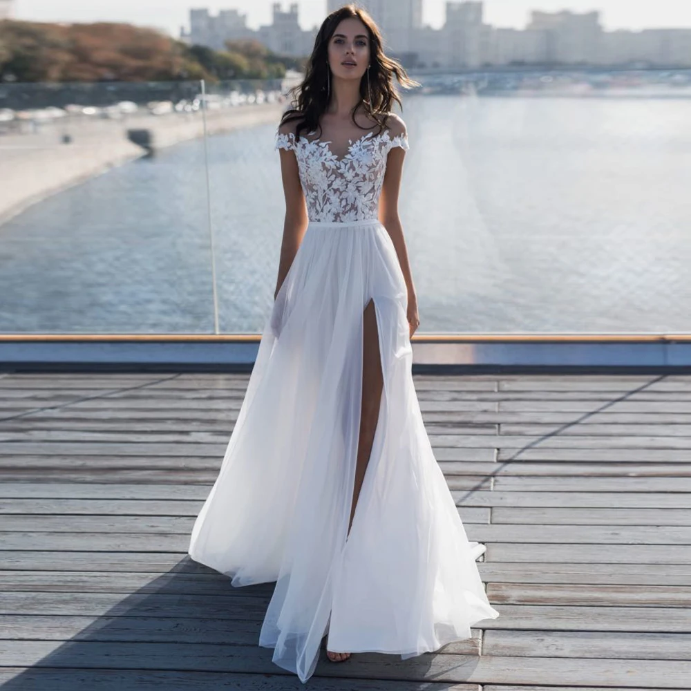 

Boho Beach Wedding Dresses 2020 Sheer Neck Short Sleeves Cover Button Back Lace Applique Vestido de noiva Long Split Bridal Gown