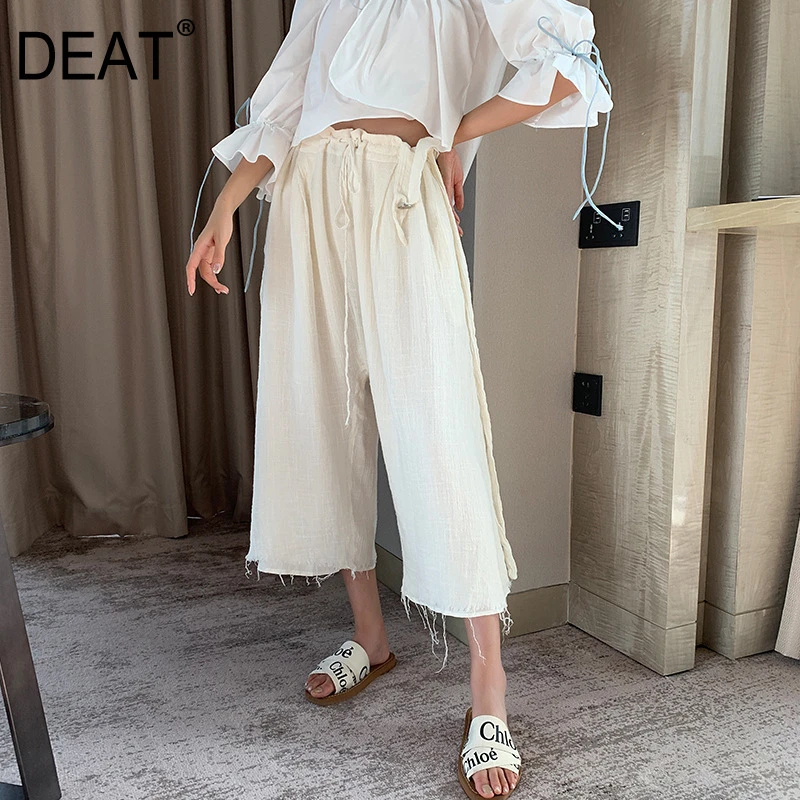 high waisted three quarter length trousers