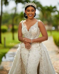 Luxury Crystals Arabic Dubai Wedding Dresses Aso Ebi V Neck Sleeveless Backless Beadings Lace With Detachable Train Bridal Gowns