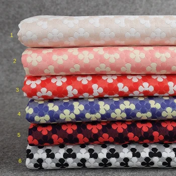 

Fashion jacquard fabric 340g / m factory direct sales double layer fine cationic plum jacquard fabric dress lining fabric