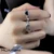 HUANZHI 2020 New Korean Vintage Daisy Flower Black Heart Glaze Sad Face Silver Color Metal Rings for Women Couple Ring Jewelry