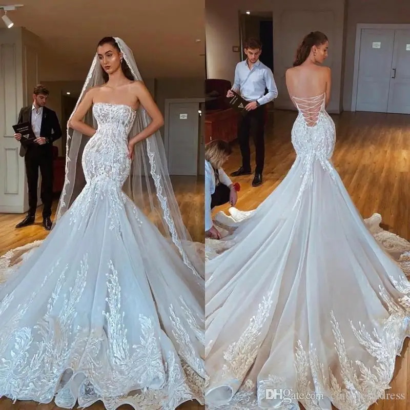 

2020 Luxury Mermaid Wedding Dresses Sheer Neck Long Sleeves Illusion Full Lace Applique Bow Overskirts Button Back Chapel Train