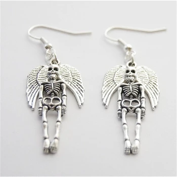 

Winged Skeleton Earrings, Halloween Earrings, Metal Earrings, Skeleton Jewelry, Skull Earrings, Goth Earrings, Bone Jewelry