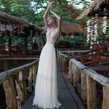 Simple White Wedding Gowns Sleeveless Spaghetti Straps Backless Sexy Chiffon V-Neck Tassel Appliques Sweep Train Lace A-Line