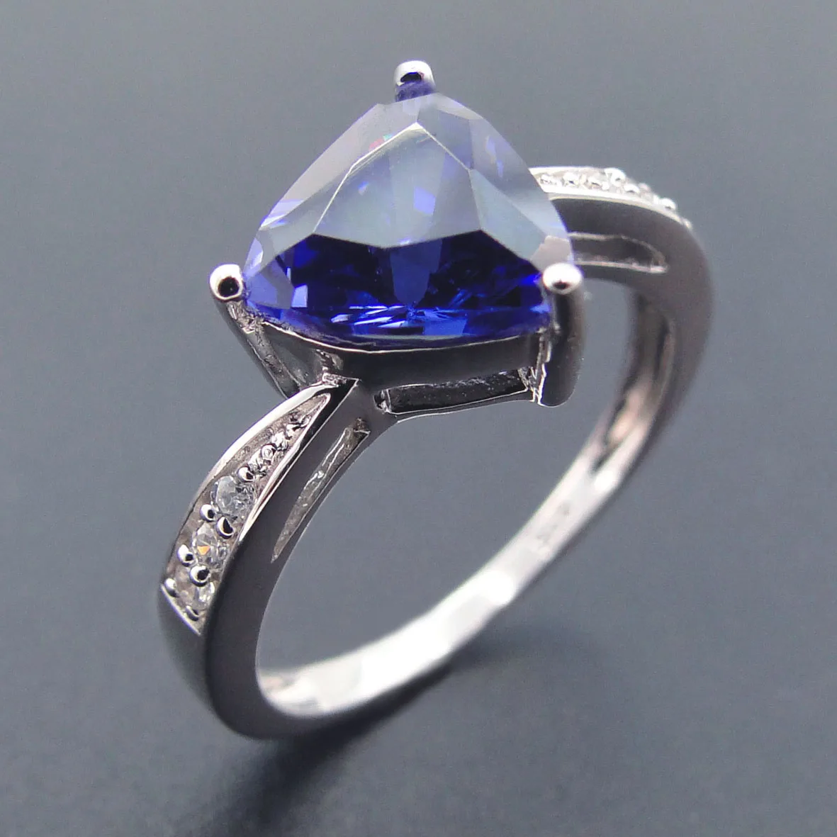 

Tanzanite Ring with White Topaz in Brass