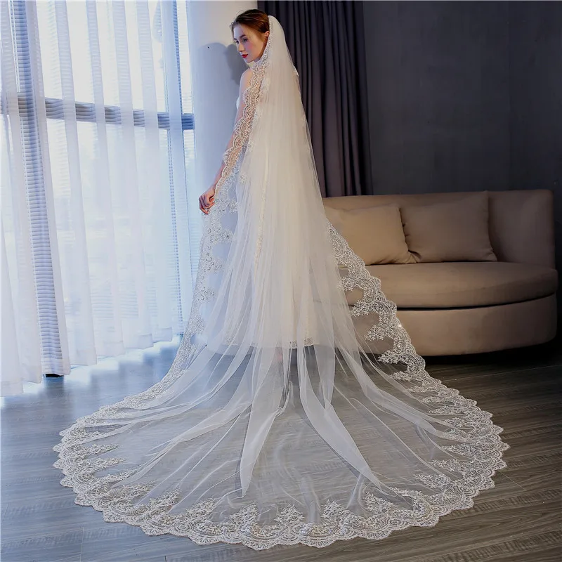 https://ae01.alicdn.com/kf/H54bead08d0e845e58d2fa0b62f2e19eav/5-Meter-White-Ivory-Cathedral-Wedding-Veils-Long-Lace-Edge-Bridal-Veil-with-Comb-Wedding-Accessories.jpg