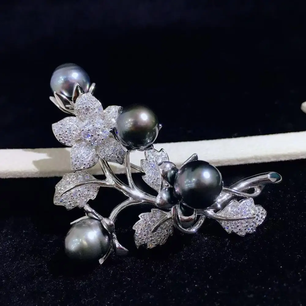 p>Tahitian black pearl and diamond mid century modern brooch.</p