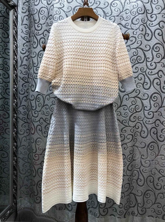 

2019 Early autumn new women's round collar stripe knitted long sleeve knitted jacket + Half skirt knitted suit 803