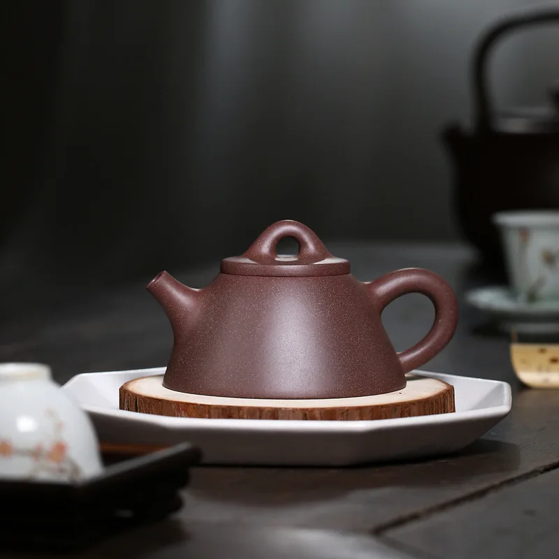 

Yixing purple clay pot master hand-made overlord ladle raw ore peach blossom mud sweat pot 230cc teapot and tea set