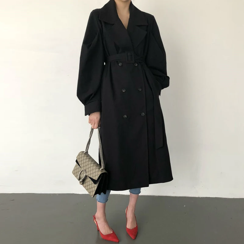 

2019 Autumn new styleLong over the knee Windbreaker Charming solid color pocket Loose Creative button array Dignified coat