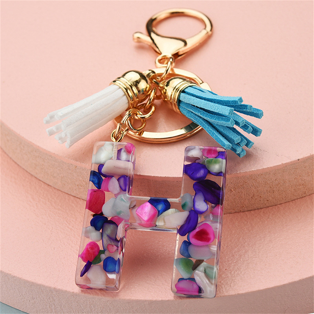 Women Keychains 26 Glitter Hollowed-out Words Handbag Tassel English Letter Keyring with Puffer Ball Charms Free Shipping
