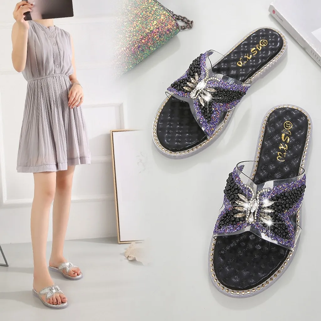 Женские шлепанцы с бантом украшенные стразами и жемчугом на плоской подошве