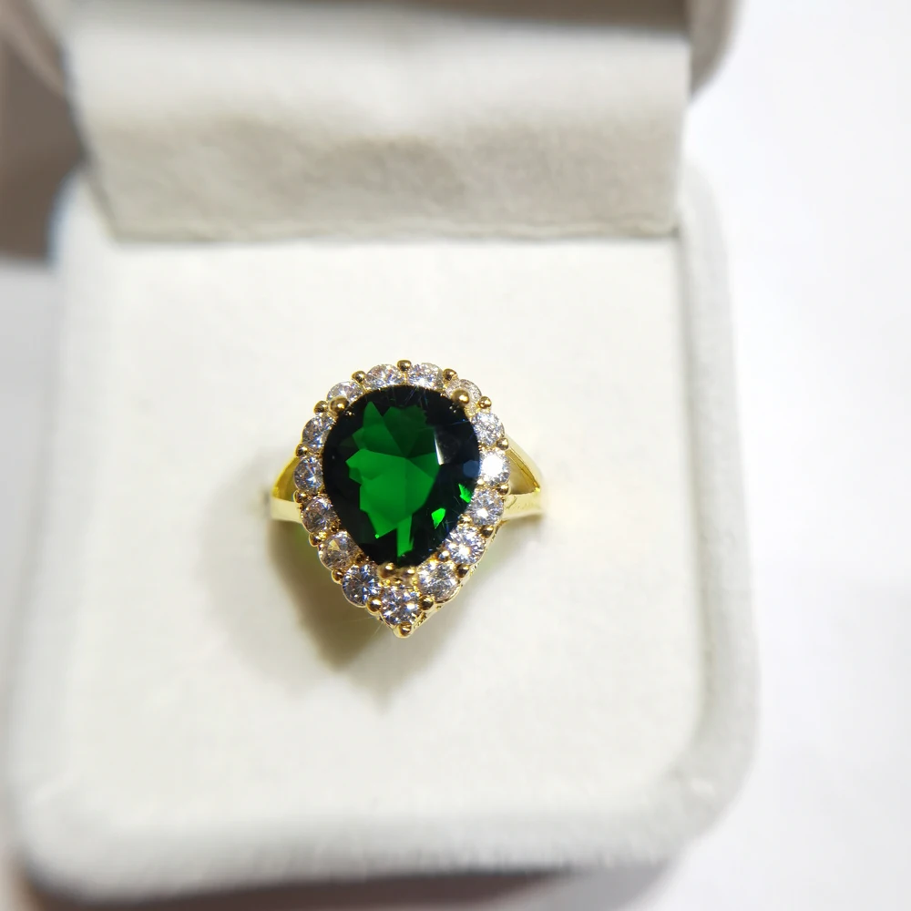 vintage-inspired green stone engagement ring
