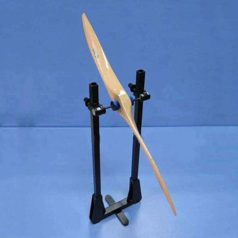 Équilibreur d'hélice magnétique de précision pour drones RC FPV, posé sur une surface plane.