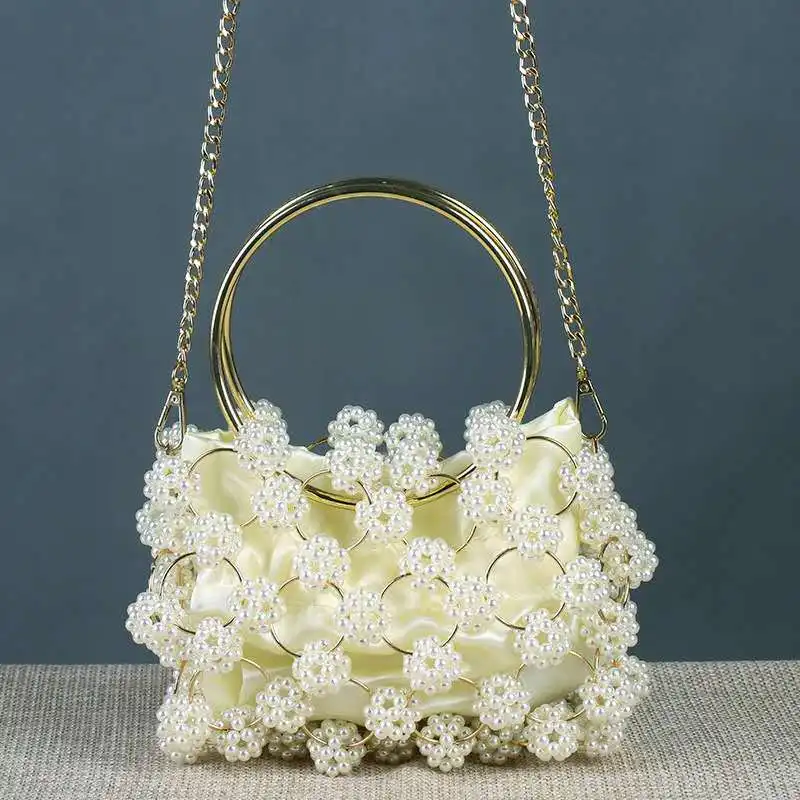 

Women's bag hollow pearl ball evening dress bag Korean handmade metal ring handle women's Pearl evening dress Handbag Purse