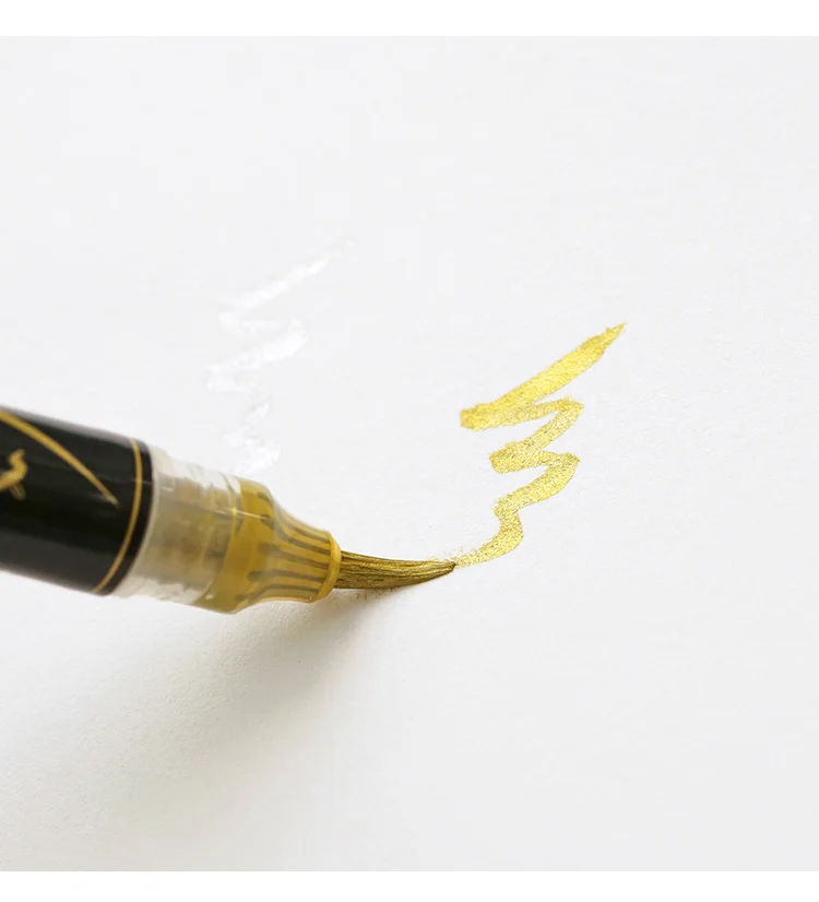 pincel dourada de cor metálica para escrita,