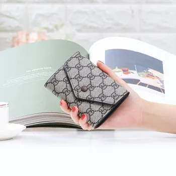 

2020new Korean wallet female short paragraph ins retro buckle change wallet female thin section wild personality card package